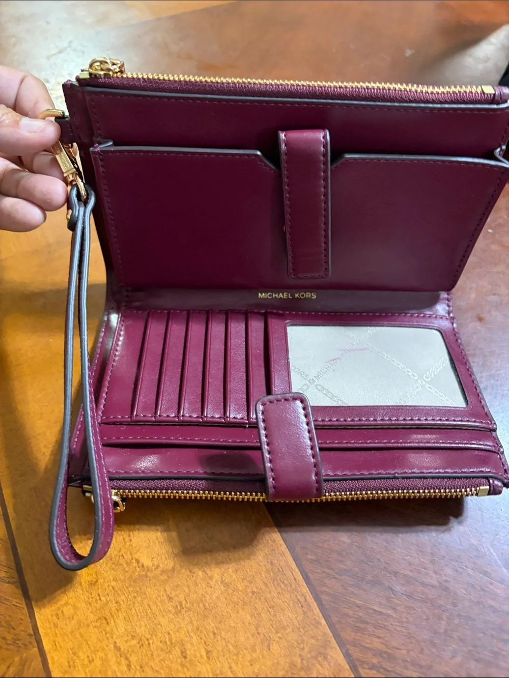 Michael Kors Pebbled Leather Wristlet in Plum